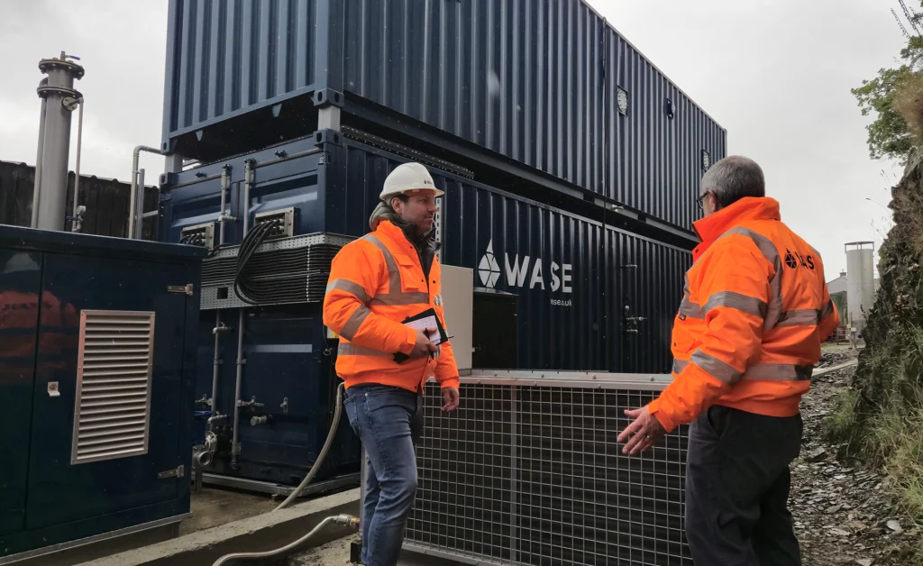 People on site in front of WASE AD product
