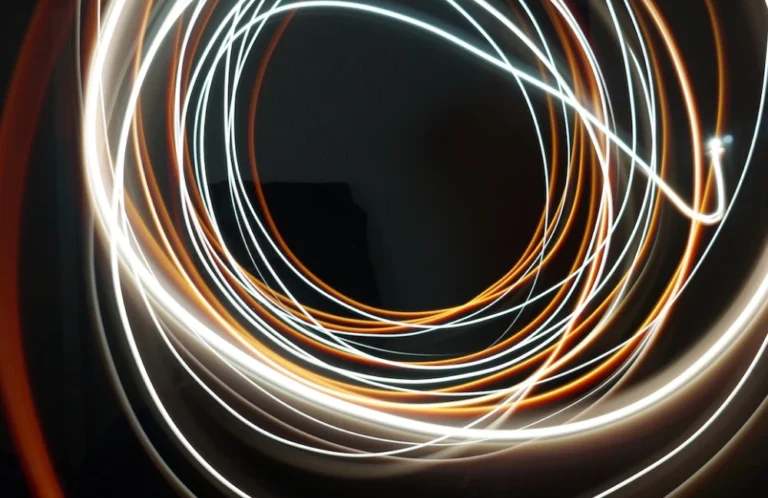 Blurred light trails in circular pattern, symbolic of energy